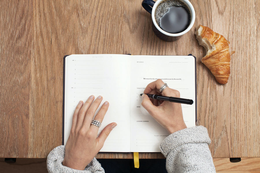 Person writing in a notebook